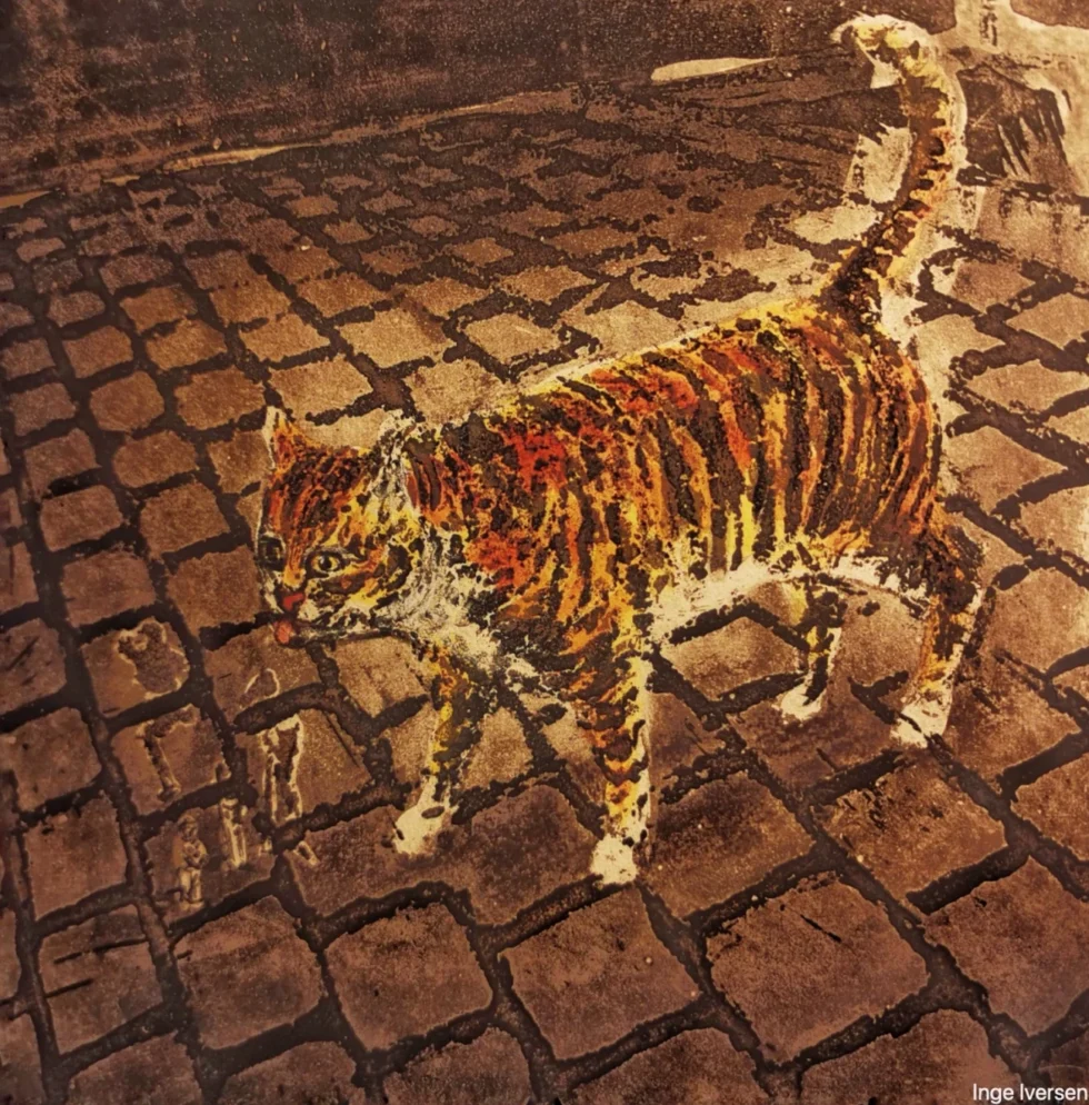 A tiger like cat walking on cobble stone in Rome